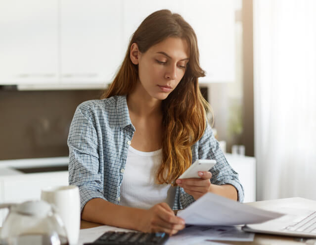 woman analyzing financial documents