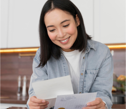 woman looking at her electric bill