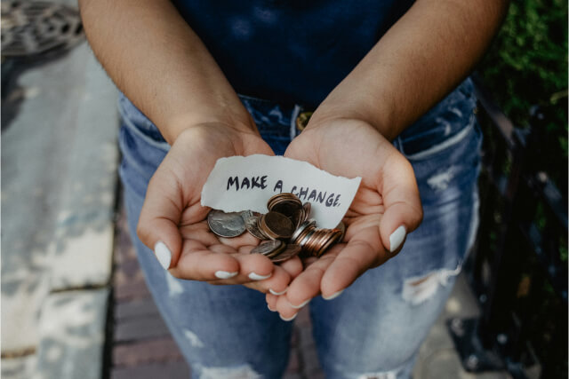 woman with coins in her hands